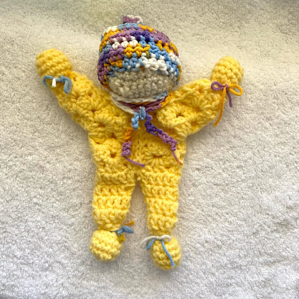 Handmade Crochet Baby yellow cotton yarn and multi-colored 100% nylon yarn.